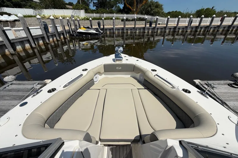 Slide: The Image of 2025 Key West 239 DFS boat with spacious seating docked at a marina. - 23