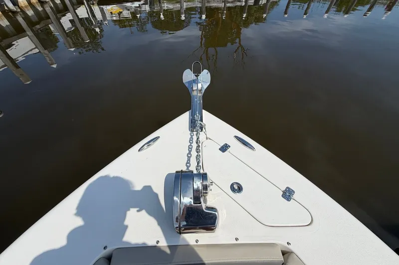 Slide: The Image of Bow view of 2025 Key West 239 DFS boat with anchor and calm water reflection. - 25