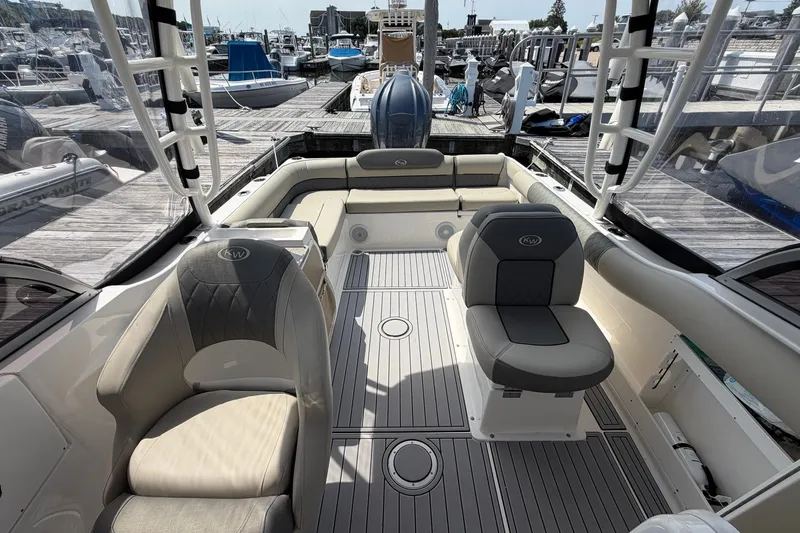 Slide: The Image of 2025 Key West 239 DFS boat interior with seating, docked at marina. - 16