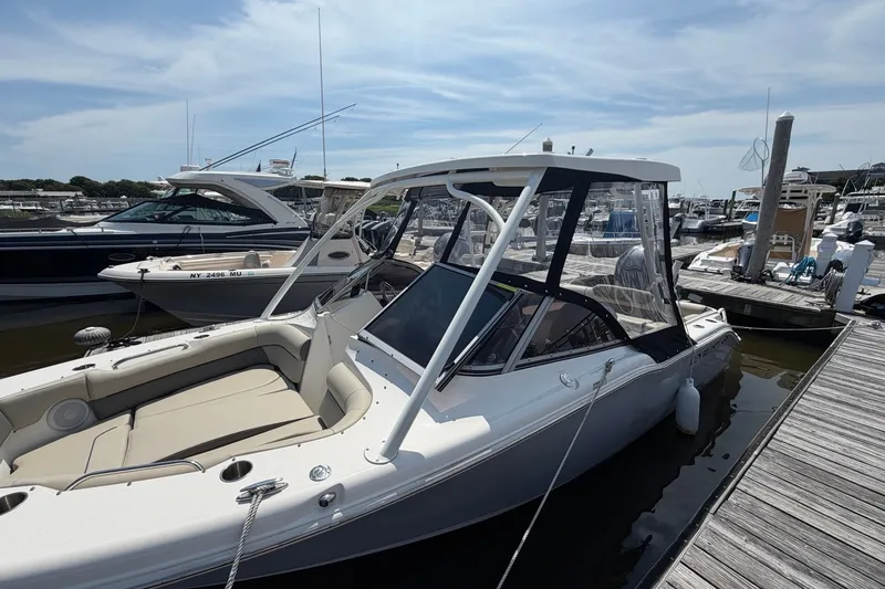 Slide: The Image of 2025 Key West 239 DFS boat docked at marina under clear sky. - 22