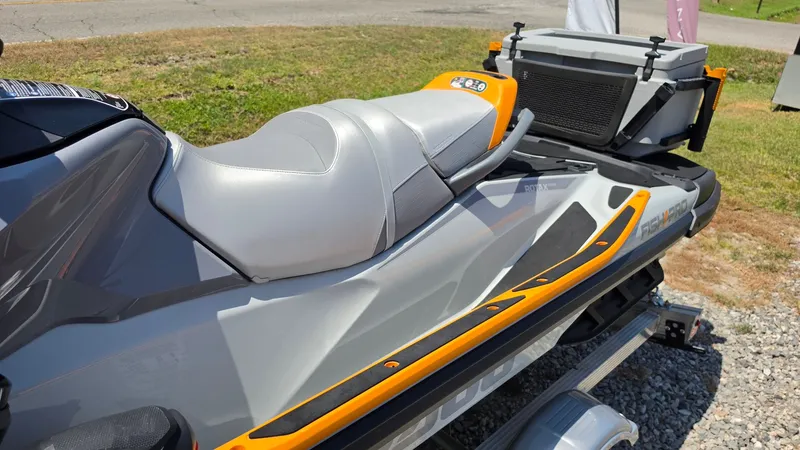 Slide: The Image of A 2023 Sea-Doo FishPro Trophy 170 iDF iBR with a gray and orange seat and a cooler at the back. - 14