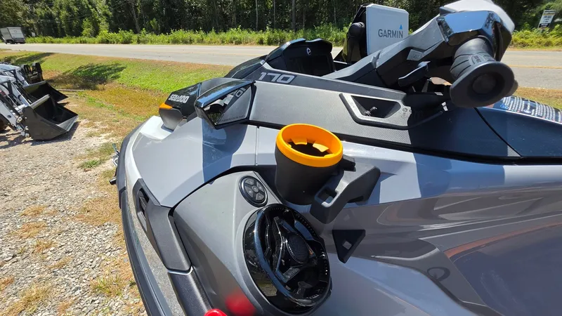 Slide: The Image of A 2023 Sea-Doo FishPro Trophy 170 with tech package, featuring Garmin technology and a cup holder. - 16