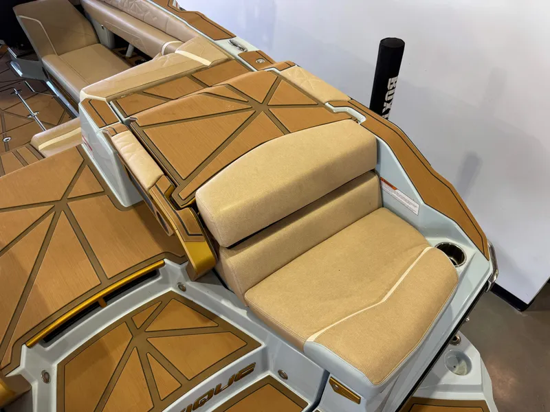 Slide: The Image of The image shows the luxurious interior of a Nautique Super Air Nautique G25 Paragon with elegant seating. - 12