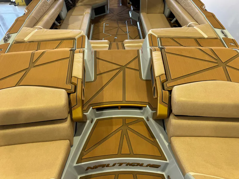 Slide: The Image of Luxurious interior of a Nautique Super Air Nautique G25 Paragon with sleek upholstery and wood flooring. - 11