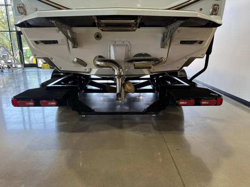 Slide: The Image of The stern of a 2026 Nautique Super Air Nautique G25 Paragon with visible propeller and exhaust. - 8