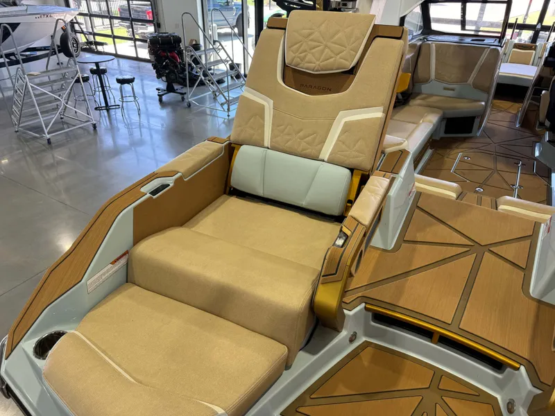 Slide: The Image of Luxurious seating area in a 2026 Nautique Super Air Nautique G25 Paragon with elegant upholstery. - 16