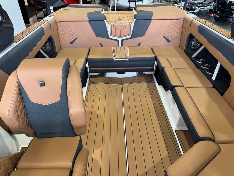 Slide: The Image of The image shows the luxurious interior of a 2026 Nautique Super Air Nautique GS22 with elegant seating. - 22