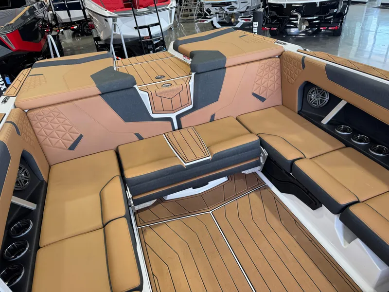 Slide: The Image of The image shows the luxurious interior of a Nautique Super Air Nautique GS22 boat with sleek seating. - 16