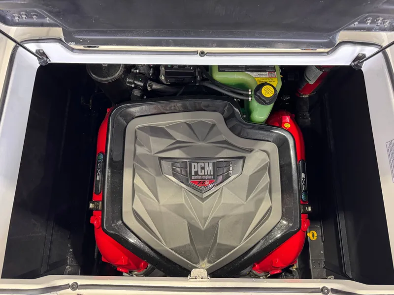 Slide: The Image of The engine compartment of a 2026 Nautique Super Air Nautique GS22 features a PCM engine with a red casing. - 27