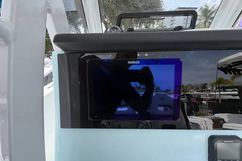 Slide: The Image of Simrad display on 2026 Sea Pro 245FLXR Sandbar boat dashboard. - 14