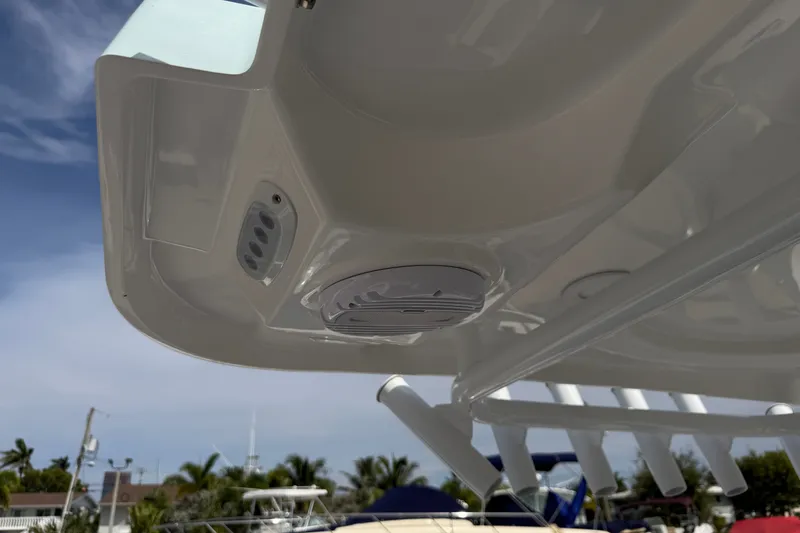 Slide: The Image of 2026 Sea Pro 245FLXR Sandbar boat with integrated speaker system and rod holders. - 32