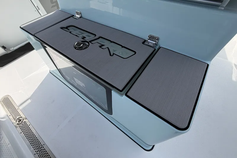 Slide: The Image of Sea Pro 245FLXR Sandbar 2026 boat compartment with sleek design and secure latch. - 18
