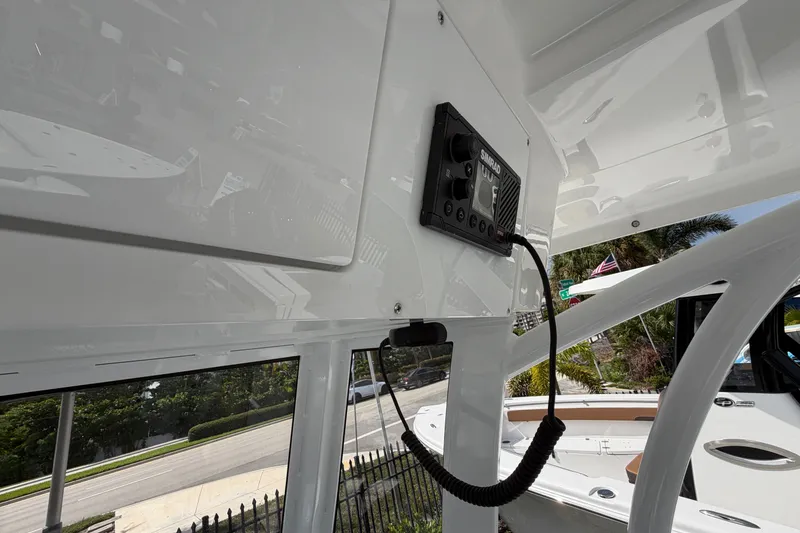 Slide: The Image of Interior view of 2026 Sea Pro 245FLXR Sandbar boat with electronic control panel. - 16