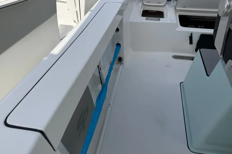 Slide: The Image of Interior view of 2026 Sea Pro 245FLXR Sandbar boat, showcasing sleek design and storage compartments. - 33