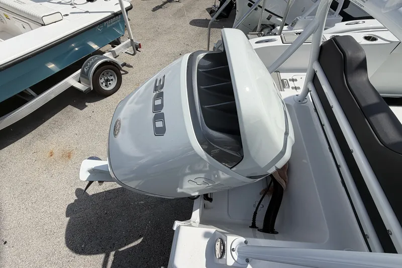 Slide: The Image of 2026 Sea Pro 245FLXR Sandbar boat with powerful 300 horsepower engine, docked on trailer. - 41
