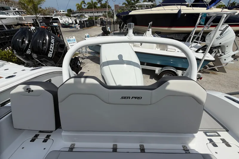Slide: The Image of 2026 Sea Pro 245FLXR Sandbar boat with dual Suzuki engines at a marina. - 20