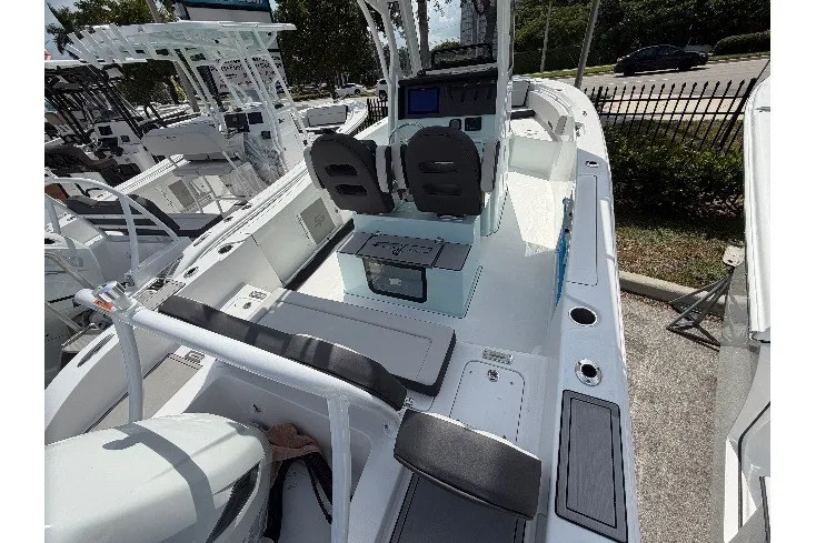 Slide: The Image of 2026 Sea Pro 245FLXR Sandbar boat interior with seating and console. - 34