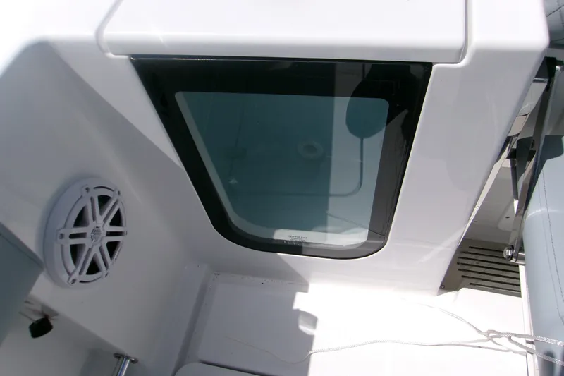 Slide: The Image of 2027 Sportsman Open 252 Center Console interior with speaker and window detail. - 16