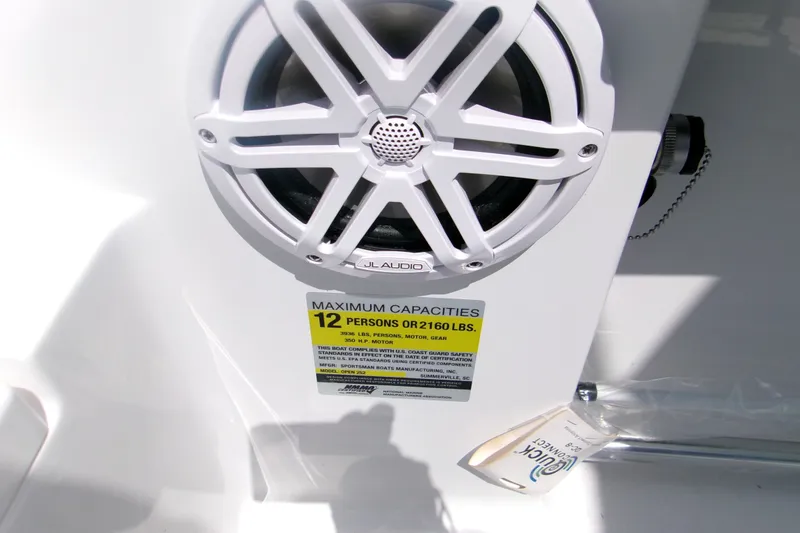 Slide: The Image of Speaker and capacity label on 2027 Sportsman Open 252 Center Console boat. - 14