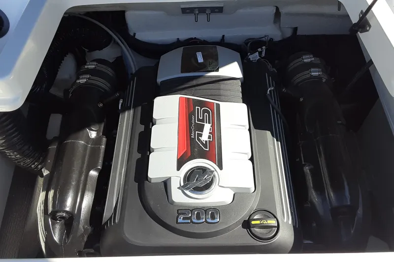 Slide: The Image of Engine compartment of a 2020 Sea Ray SPX 190 boat featuring a MerCruiser 4.5 engine. - 13