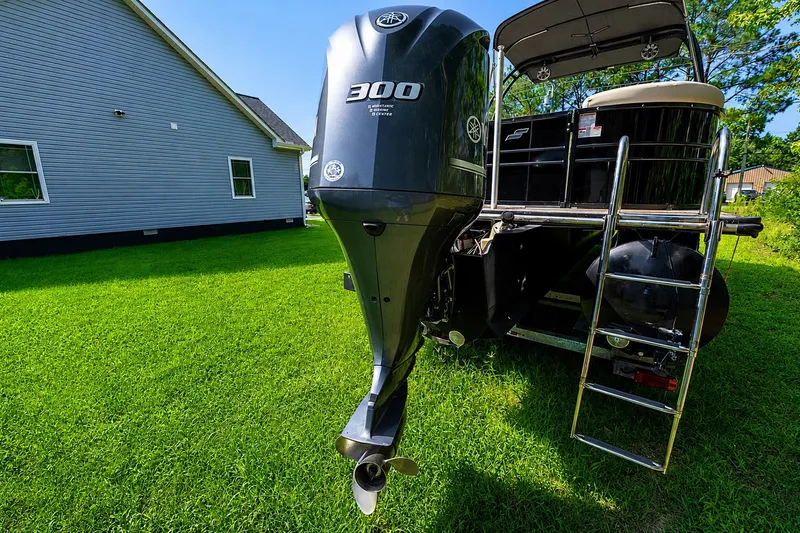 Slide: The Image of 2018 Starcraft SLS 5 Q boat with Yamaha 300 outboard motor on grass. - 16
