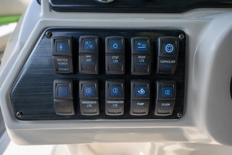 Slide: The Image of Control panel of a 2018 Starcraft SLS 5 Q boat with labeled switches. - 15
