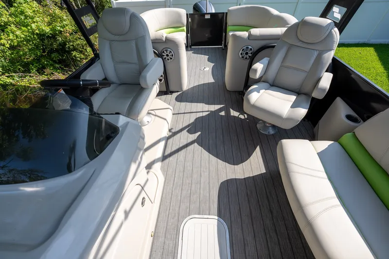 Slide: The Image of 2018 Starcraft SLS 5 Q boat interior with plush seating and modern design. - 13