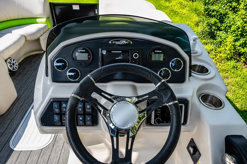 Slide: The Image of 2018 Starcraft SLS 5 Q boat dashboard with steering wheel and control panel. - 4