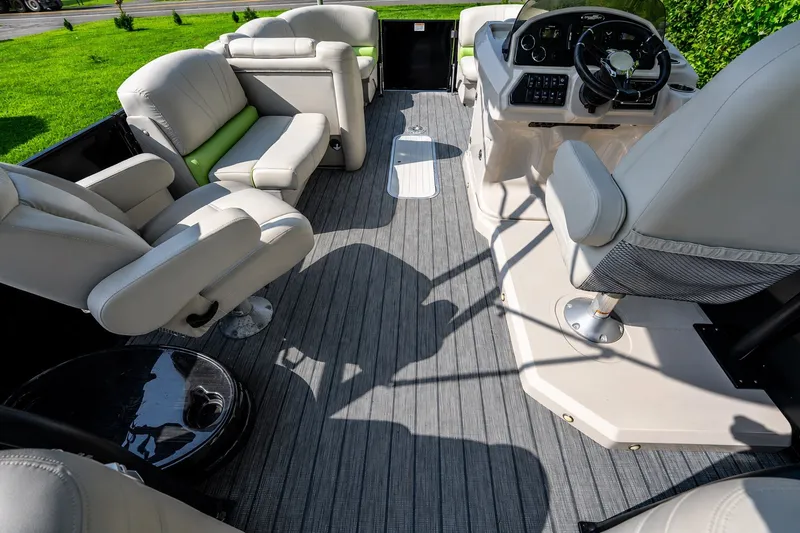Slide: The Image of Luxurious interior of 2018 Starcraft SLS 5 Q boat with plush seating and modern dashboard. - 3