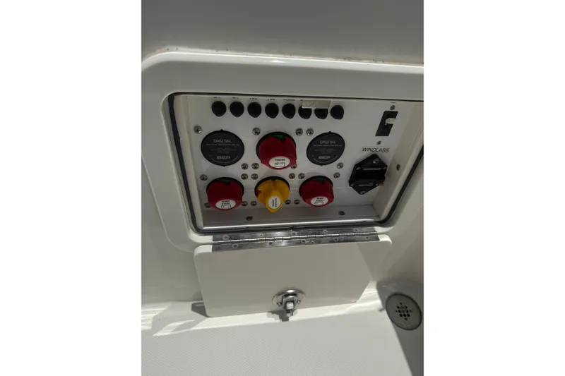Slide: The Image of Control panel of 2022 World Cat 325 DC boat with switches and dials. - 11