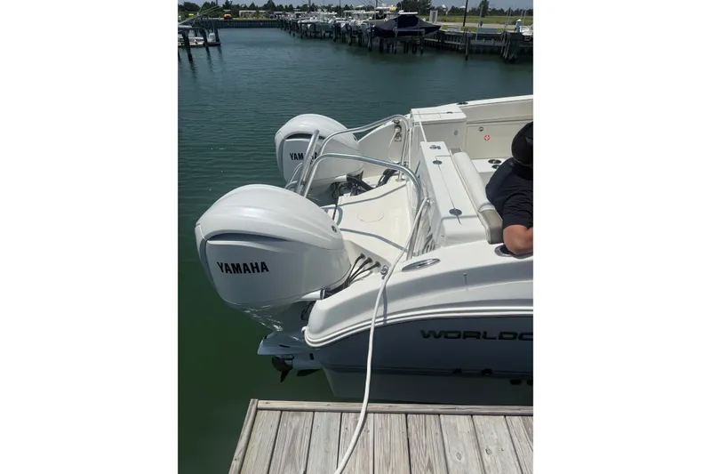 Slide: The Image of 2022 World Cat 325 DC boat with Yamaha engines docked at marina. - 10