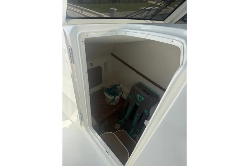 Slide: The Image of Interior cabin of 2022 World Cat 325 DC boat, featuring storage space and seating. - 3