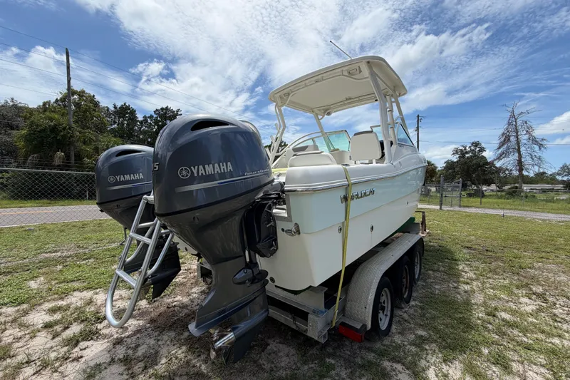 Slide: The Image of 2022 World Cat 230 DC boat with dual Yamaha engines on a trailer. - 27