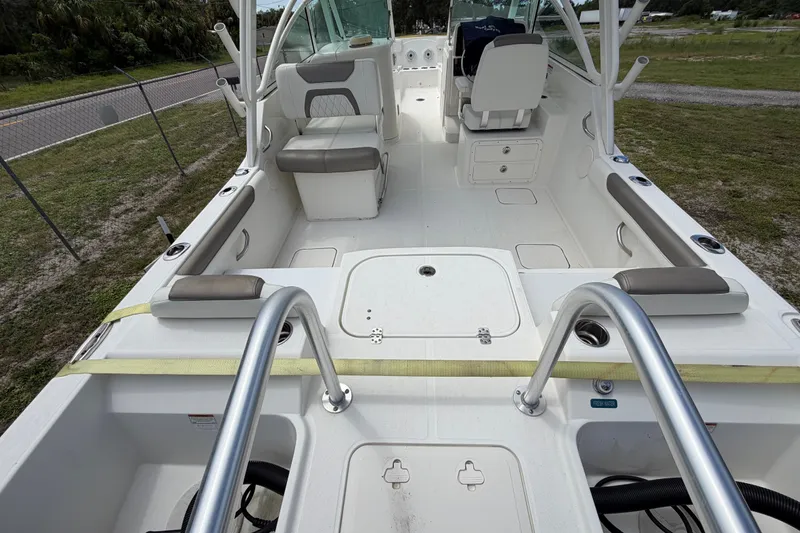 Slide: The Image of 2022 World Cat 230 DC boat interior with seating and storage compartments. - 34