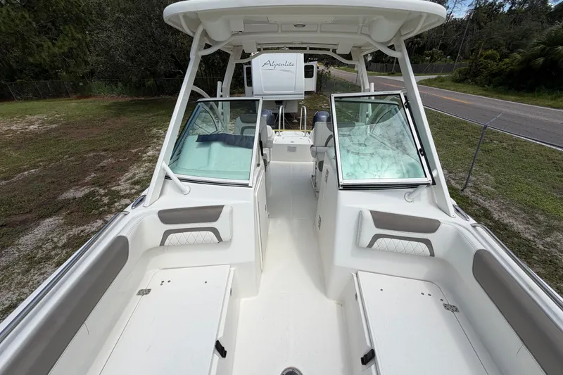 Slide: The Image of 2022 World Cat 230 DC boat interior with open deck and seating. - 62