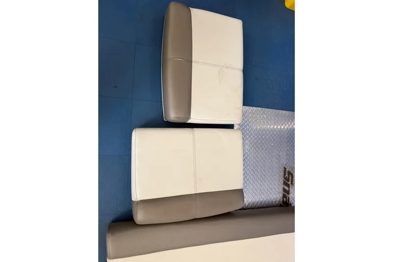 Slide: The Image of Boat seat cushions for 2022 World Cat 230 DC, featuring white and gray upholstery. - 73
