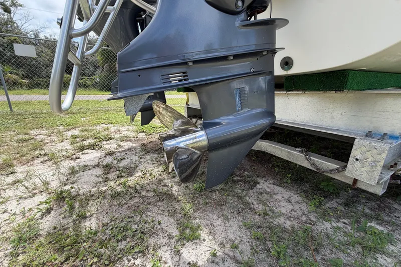Slide: The Image of Outboard motor of 2022 World Cat 230 DC boat on trailer, showcasing propeller detail. - 26