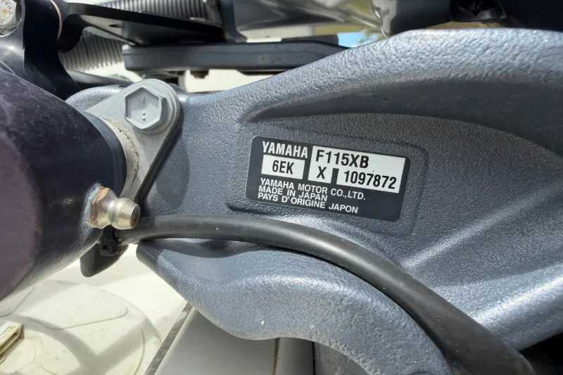 Slide: The Image of Close-up of Yamaha F115XB engine label on 2022 World Cat 230 DC boat. - 76