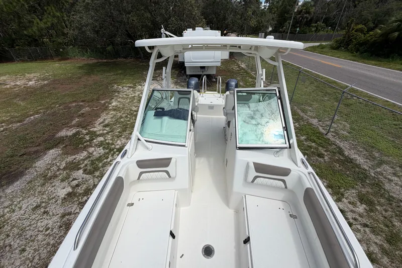 Slide: The Image of 2022 World Cat 230 DC boat with dual consoles and spacious seating. - 61