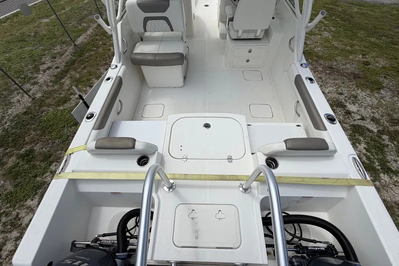 Slide: The Image of 2022 World Cat 230 DC boat interior with seating and storage compartments. - 35