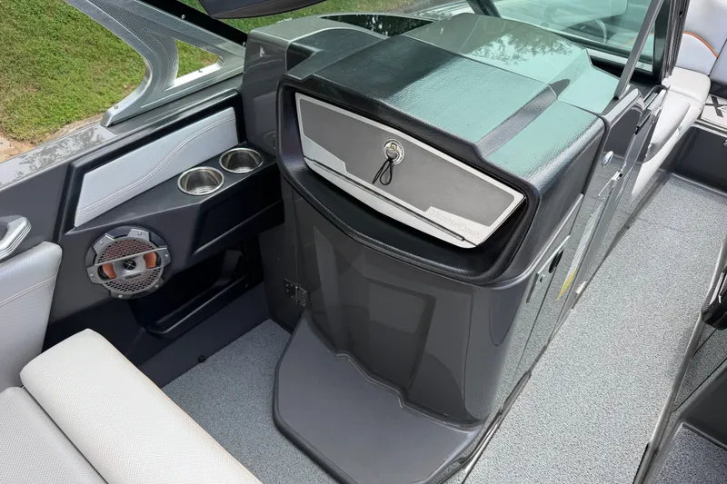 Slide: The Image of Interior of 2018 MasterCraft X26 boat with speaker and cup holders. - 12