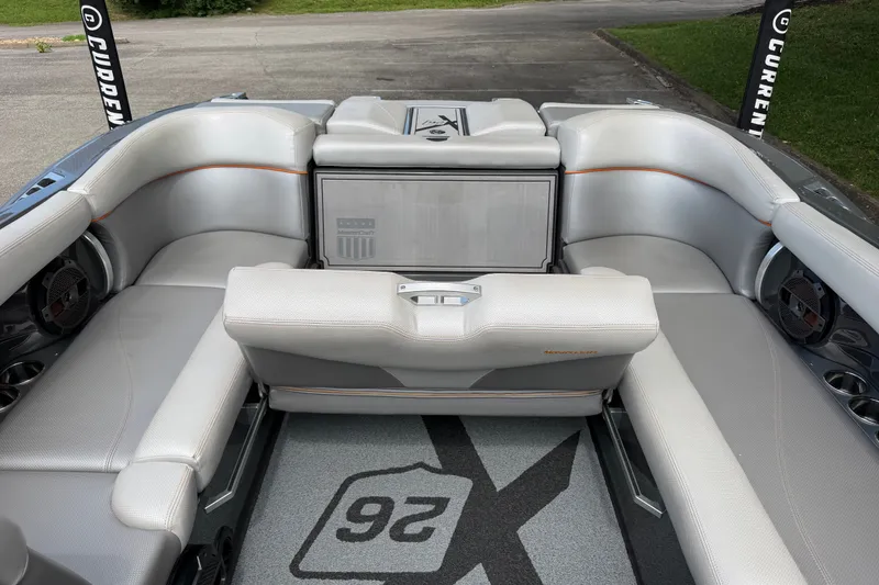 Slide: The Image of 2018 MasterCraft X26 boat interior with luxurious seating and modern design. - 16