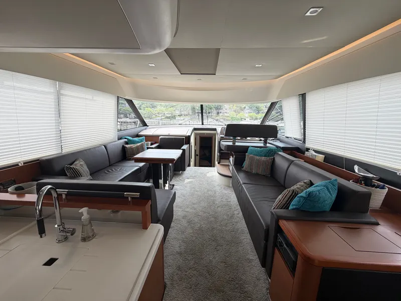 Slide: The Image of Interior of a 2015 Prestige 550 with modern sofas and large windows. - 18