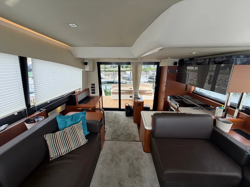 Slide: The Image of Interior of a 2015 Prestige 550 with modern furnishings and large windows. - 16