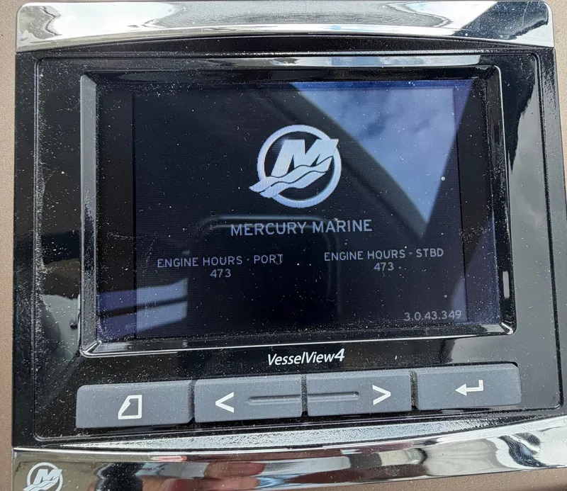 Slide: The Image of A Mercury Marine VesselView4 display shows 473 engine hours for both engines. - 23