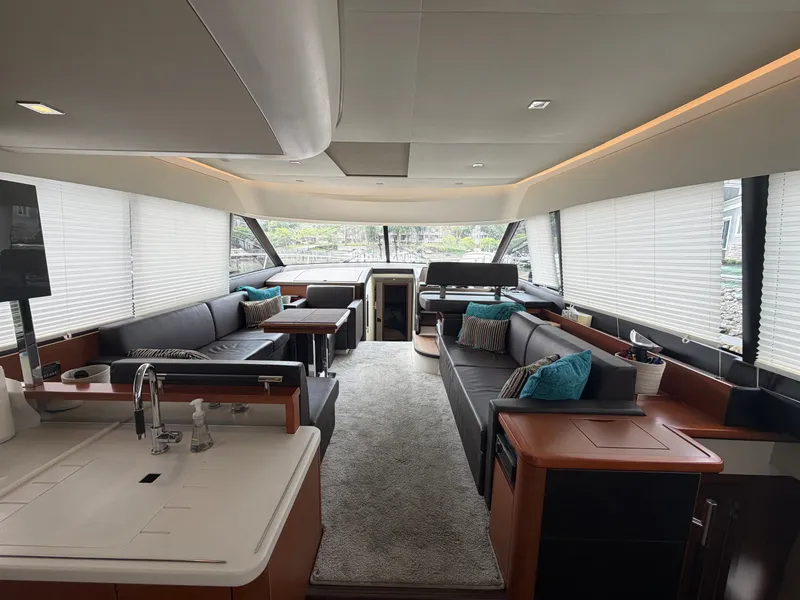 Slide: The Image of Interior of a 2015 Prestige 550 with elegant furnishings and large windows. - 12