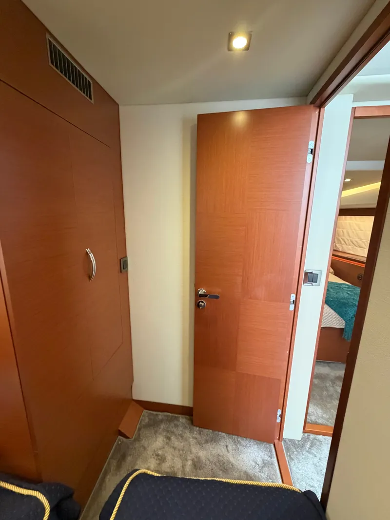 Slide: The Image of Interior of a 2015 Prestige 550 with wooden doors and carpeted flooring. - 31