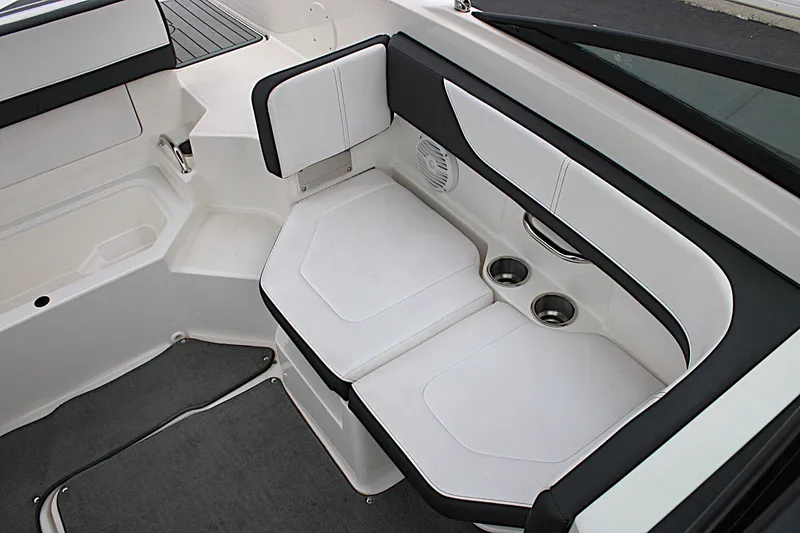 Slide: The Image of 2017 Sea Ray SPX 190 Outboard interior seating with cup holders and speaker. - 14