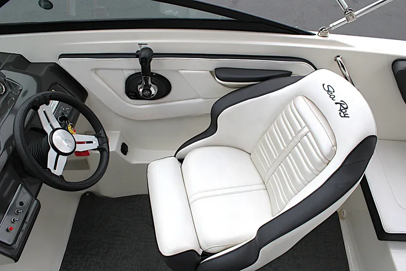 Slide: The Image of Interior of 2017 Sea Ray SPX 190 Outboard boat with steering wheel and captain's seat. - 17