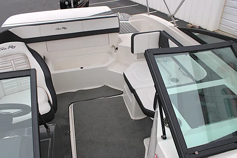 Slide: The Image of 2017 Sea Ray SPX 190 Outboard interior with seating and windshield, showcasing sleek design. - 15